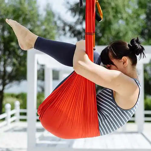 woman doing aerial fly yoga exercising outdoor woman doing aerial fly yoga exercising outdoor